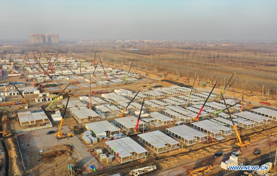 Aerial photo taken on Jan. 18, 2021 shows the Huangzhuang apartment COVID-19 quarantine center under construction in Shijiazhuang, north China's Hebei Province. Construction of the main structures of the Huangzhuang apartment COVID-19 quarantine center in Shijiazhuang is nearing the end. With a total floor area of 34 hectares, the facility will house close contacts or secondary close contacts of COVID-19 confirmed cases. (Xinhua/Yang Shiyao)