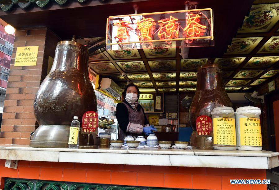 A staff member is seen at a herbal tea shop in south China's Hong Kong, Jan. 18, 2021. Hong Kong's Center for Health Protection (CHP) reported 107 additional confirmed cases of COVID-19 on Monday, a new high in about one month. The new cases included 102 local infections and five imported ones, taking its total tally to 9,664. More than 40 of the new local cases were untraceable and there were about 50 cases tested positive preliminarily, according to a CHP press briefing. (Xinhua/Lo Ping Fai)