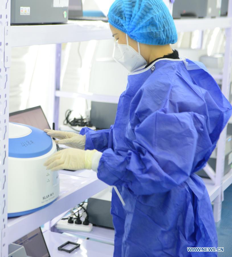 A staff member examines nucleic acid samples at the nucleic acid test laboratory named Huoyan, or Fire Eye, in Shijiazhuang, north China's Hebei Province, Jan. 18, 2021. On Jan. 8, a nucleic acid test laboratory named Huoyan, or Fire Eye, was built in only 10 hours and put into use in 21 hours in Shijiazhuang. It can test up to 1 million samples a day, significantly improving the city's testing capability. (Xinhua/Jin Haoyuan)