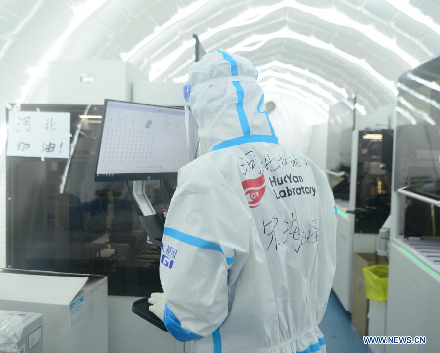 Staff member Song Haifeng work on nucleic acid samples at the nucleic acid test laboratory named Huoyan, or Fire Eye, in Shijiazhuang, north China's Hebei Province, Jan. 18, 2021. On Jan. 8, a nucleic acid test laboratory named Huoyan, or Fire Eye, was built in only 10 hours and put into use in 21 hours in Shijiazhuang. It can test up to 1 million samples a day, significantly improving the city's testing capability. (Xinhua/Jin Haoyuan)