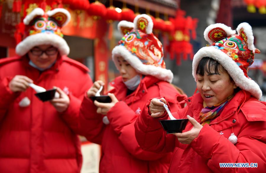 Staff members of Yongxingfang community eat Laba porridge in Xi'an, northwest China's Shaanxi Province, Jan. 20, 2020. The Laba Festival, literally the eighth day of the 12th lunar month, is considered a prelude to the Spring Festival, or Chinese Lunar New Year. (Xinhua/Liu Xiao)