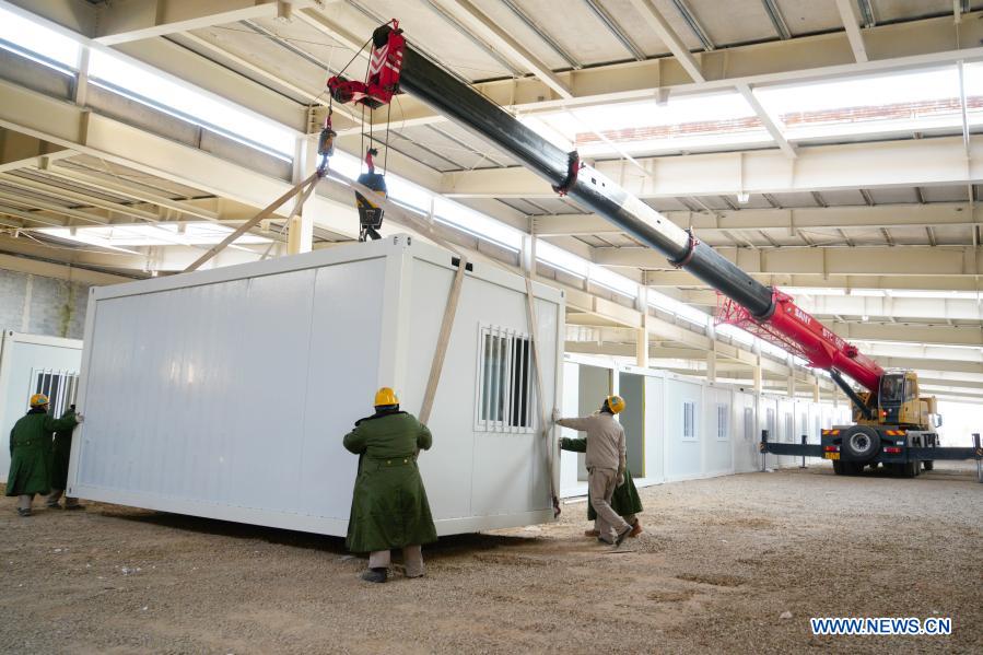 Workers build a COVID-19 quarantine center in Nangong City, north China's Hebei Province, Jan. 19, 2021. (Xinhua)