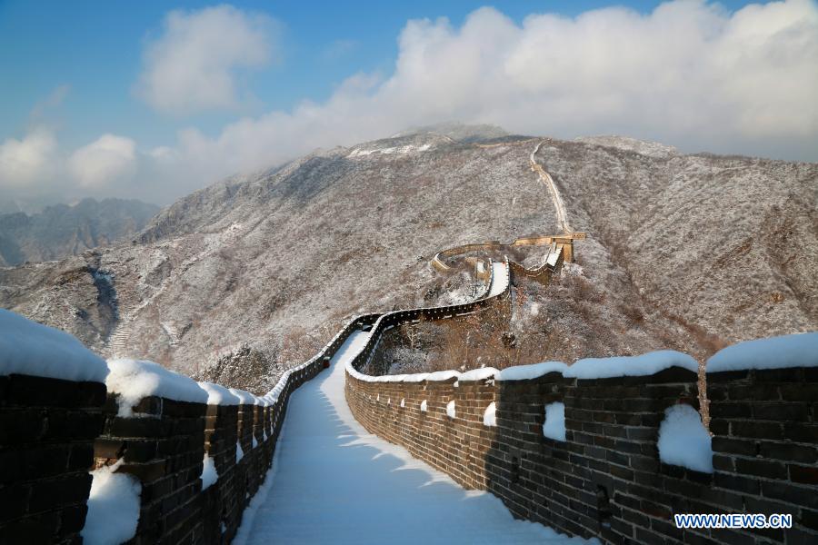 Photo taken on Jan. 19, 2021 shows a snow-covered Mutianyu section of the Great Wall in Huairou District, Beijing, capital of China. (Photo by Bu Xiangdong/Xinhua)