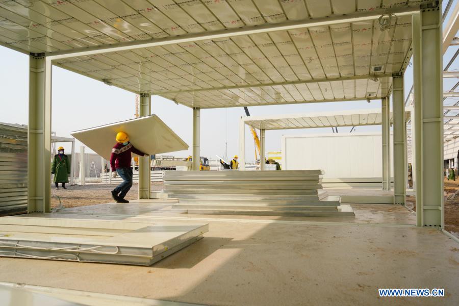 Workers build a COVID-19 quarantine center in Nangong City, north China's Hebei Province, Jan. 19, 2021. (Xinhua)