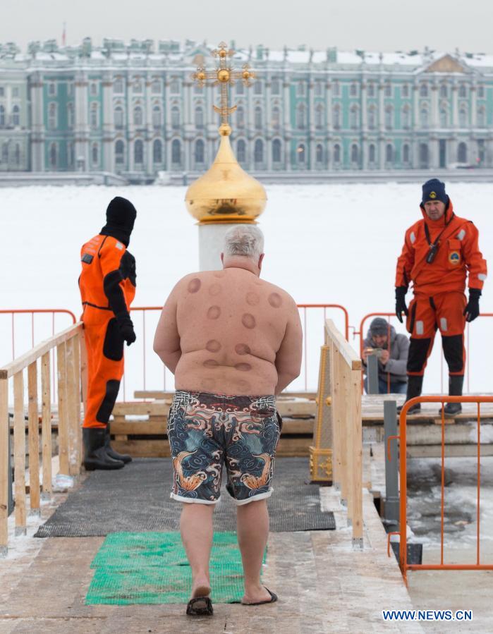 A man prepares to bathe in icy water during the Orthodox Epiphany celebrations in St. Petersburg, Russia, Jan. 19, 2021. (Photo by Irina Motina/Xinhua)