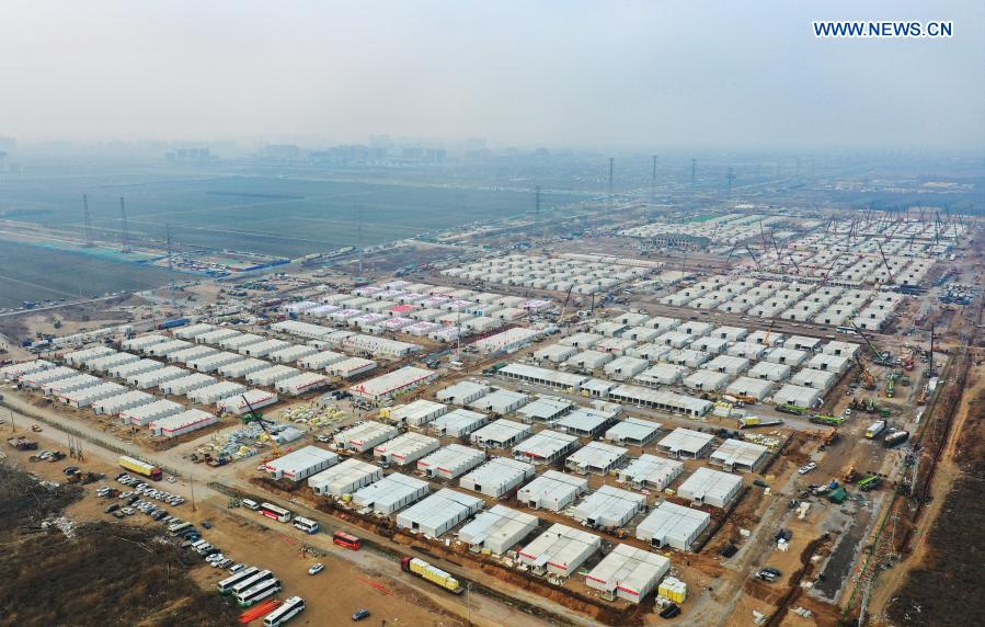 Aerial photo taken on Jan. 20, 2021 shows the construction site of the Huangzhuang Apartment quarantine center in Shijiazhuang, north China's Hebei Province. Located at the junction of Zhengding County and Gaocheng District in Shijiazhuang, the Huangzhuang Apartment COVID-19 quarantine center project has an area of 658 mu (about 43.87 hectares), and a capacity of 4,156 rooms, which is used to accommodate close contacts and sub-close contacts of confirmed COVID-19 patients. (Xinhua/Yang Shiyao)