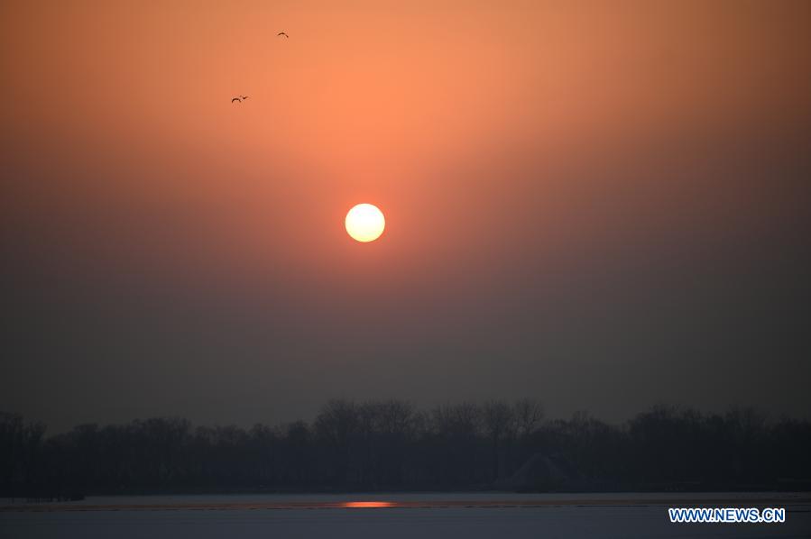 Photo taken on Jan. 21, 2021 shows a view of sunset at the Summer Palace in Beijing, capital of China. (Photo by Hu Zhixuan/Xinhua)