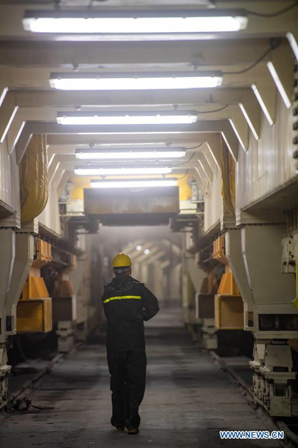 A worker walks at the construction site of Tianshan Shengli tunnel in northwest China's Xinjiang Uygur Autonomous Region, Feb. 4, 2021. Tianshan Shengli tunnel, with a total length of about 22 kilometers, is currently the longest highway tunnel under construction in China. Started in 2020, the tunnel, a six-year project on the Urumqi-Yuli highway, passes through a cold and high altitude zone, with harsh climate and geological condition. After completion and opened to traffic, it will provide safer and more convenient travel to the passengers and promote local economic and social development. (Xinhua/Hu Huhu)