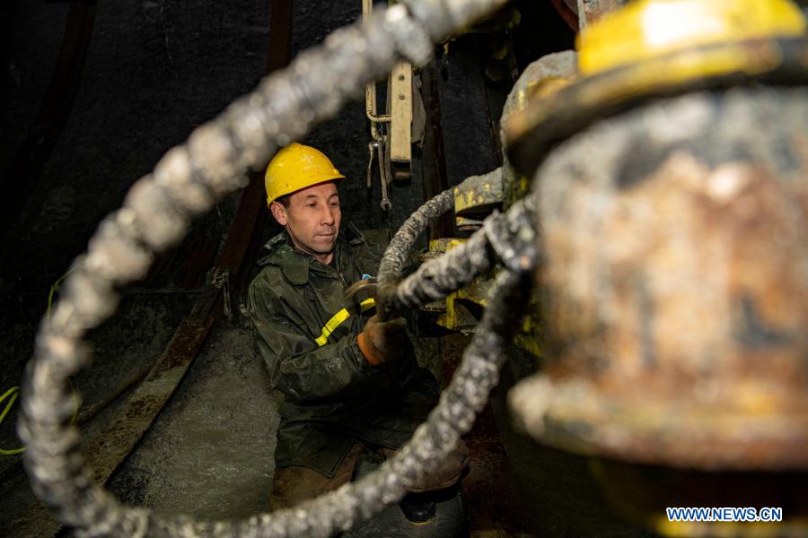 A worker is busy at the construction site of Tianshan Shengli tunnel in northwest China's Xinjiang Uygur Autonomous Region, Feb. 4, 2021. Tianshan Shengli tunnel, with a total length of about 22 kilometers, is currently the longest highway tunnel under construction in China. Started in 2020, the tunnel, a six-year project on the Urumqi-Yuli highway, passes through a cold and high altitude zone, with harsh climate and geological condition. After completion and opened to traffic, it will provide safer and more convenient travel to the passengers and promote local economic and social development. (Xinhua/Hu Huhu)