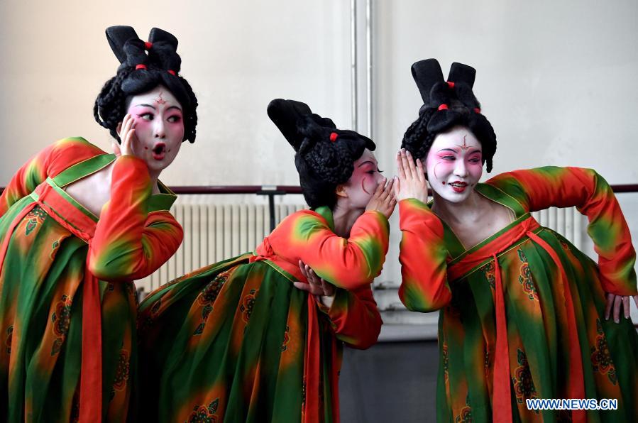 Dancers practice at Zhengzhou Song and Dance Theater in Zhengzhou, central China's Henan Province, Feb. 20, 2021. Fourteen dancers from Zhengzhou Song and Dance Theater have been very busy since the dancing they performed went viral online. The performance, named Banquet of Tang Palace, was staged at the Spring Festival gala of Henan Province. Brilliantly choreographed and acted, the dancing has almost brought ancient dancing figurines of the Tang Dynasty (618-907) alive. The performance Banquet of Tang Palace, inspired by the dancing figurines displayed at a museum, tells a story about the life of female musicians during the Tang Dynasty. 