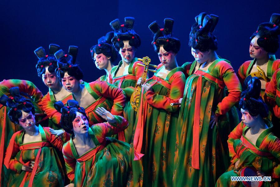 Dancers perform Banquet of Tang Palace during the finals of Lotus Awards in Luoyang, central China's Henan Province, Oct. 16, 2020. Fourteen dancers from Zhengzhou Song and Dance Theater have been very busy since the dancing they performed went viral online. The performance, named Banquet of Tang Palace, was staged at the Spring Festival gala of Henan Province. Brilliantly choreographed and acted, the dancing has almost brought ancient dancing figurines of the Tang Dynasty (618-907) alive. The performance Banquet of Tang Palace, inspired by the dancing figurines displayed at a museum, tells a story about the life of female musicians during the Tang Dynasty. 