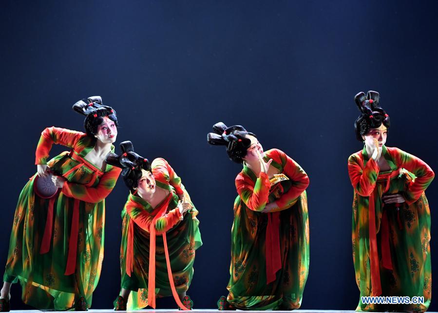 Dancers perform Banquet of Tang Palace during the finals of Lotus Awards in Luoyang, central China's Henan Province, Oct. 16, 2020. Fourteen dancers from Zhengzhou Song and Dance Theater have been very busy since the dancing they performed went viral online. The performance, named Banquet of Tang Palace, was staged at the Spring Festival gala of Henan Province. Brilliantly choreographed and acted, the dancing has almost brought ancient dancing figurines of the Tang Dynasty (618-907) alive. The performance Banquet of Tang Palace, inspired by the dancing figurines displayed at a museum, tells a story about the life of female musicians during the Tang Dynasty. 