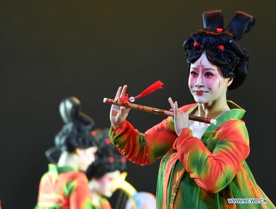 Dancers perform Banquet of Tang Palace during the finals of Lotus Awards in Luoyang, central China's Henan Province, Oct. 16, 2020. Fourteen dancers from Zhengzhou Song and Dance Theater have been very busy since the dancing they performed went viral online. The performance, named Banquet of Tang Palace, was staged at the Spring Festival gala of Henan Province. Brilliantly choreographed and acted, the dancing has almost brought ancient dancing figurines of the Tang Dynasty (618-907) alive. The performance Banquet of Tang Palace, inspired by the dancing figurines displayed at a museum, tells a story about the life of female musicians during the Tang Dynasty. 