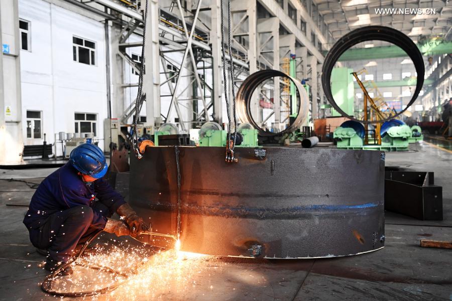 A worker is busy at a workshop of Harbin Boiler Co., Ltd. in Harbin, capital of northeast China's Heilongjiang Province, Feb. 23, 2021. (Xinhua/Wang Jianwei)