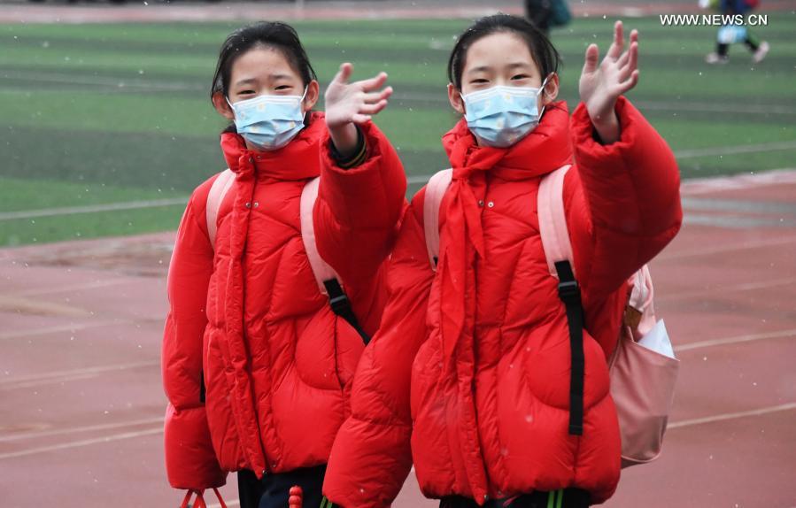 Students walk in the campus of Beijing Taipinglu Primary school in Haidian District of Beijing, capital of China, March 1, 2021. Middle school and primary school students returned to school as scheduled for the spring semester in Beijing on Monday amid coordinated epidemic control efforts. (Xinhua/Ren Chao)