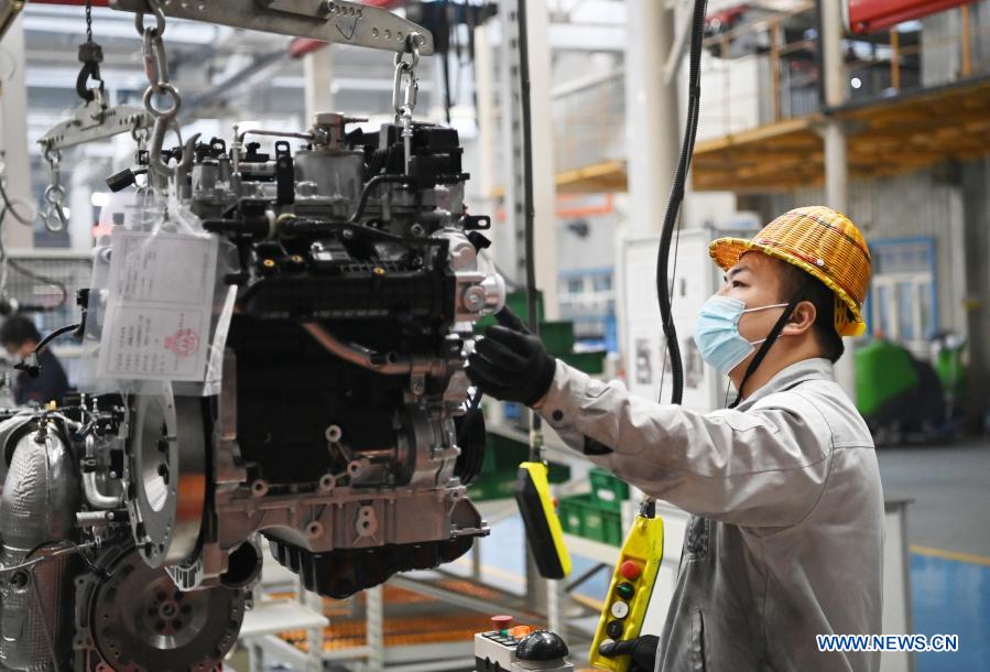 A worker operates at a workshop of the Dongan Auto Engine Co., Ltd. in Harbin City of northeast China's Heilongjiang Province, March 2, 2021. The Dongan Auto Engine Co., Ltd. sold 71,300 automotive engines in the first two months of 2021, up by 85.18 percent year-on-year, marking a benign start. (Xinhua/Wang Jianwei)