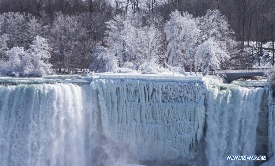 Ice and snow covered Niagara Falls is seen at the base of the Canadian side of Niagara Falls in Ontario, Canada, on March 2, 2021. (Photo by Zou Zheng/Xinhua)