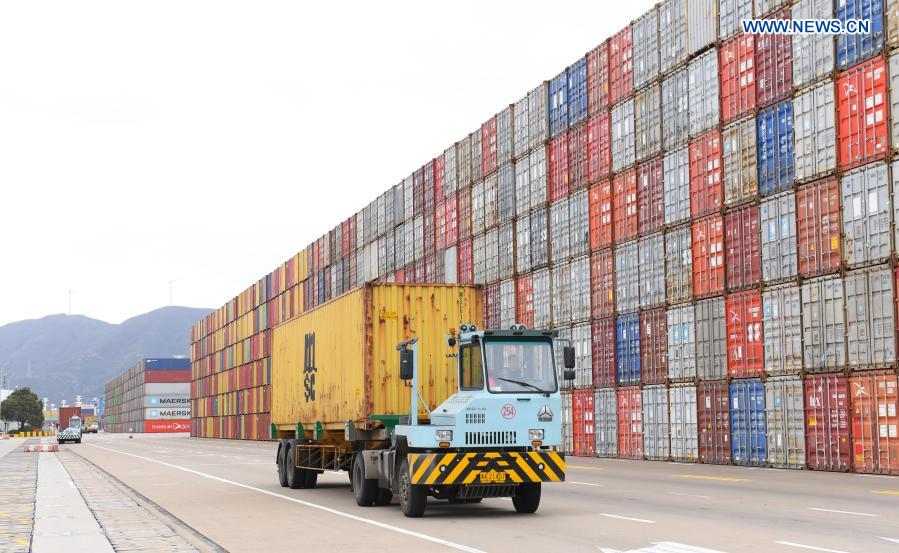 A container truck delivers a container at the Ningbo Zhoushan Port in Ningbo, east China's Zhejiang Province, March 3, 2021. Both cargo and container throughput of Ningbo Zhoushan Port registered year-on-year growth of 4.7 percent and 4.3 percent respectively in 2020. The port saw its cargo throughput reach 1.172 billion tons while the container throughput achieved 28.72 million twenty-foot equivalent units (TEUs) last year. (Xinhua/Weng Xinyang)