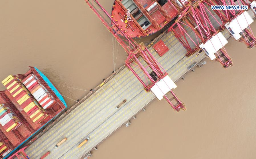 Aerial photo taken on March 3, 2021 shows a view at the Ningbo Zhoushan Port in Ningbo, east China's Zhejiang Province. Both cargo and container throughput of Ningbo Zhoushan Port registered year-on-year growth of 4.7 percent and 4.3 percent respectively in 2020. The port saw its cargo throughput reach 1.172 billion tons while the container throughput achieved 28.72 million twenty-foot equivalent units (TEUs) last year. (Xinhua/Weng Xinyang)