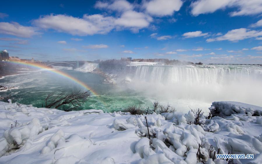 Ice and snow covered Niagara Falls is seen at the base of the Canadian side of Niagara Falls in Ontario, Canada, on March 2, 2021. (Photo by Zou Zheng/Xinhua)