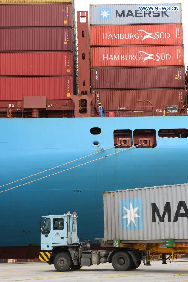 A container truck delivers a container at the Ningbo Zhoushan Port in Ningbo, east China's Zhejiang Province, March 3, 2021. Both cargo and container throughput of Ningbo Zhoushan Port registered year-on-year growth of 4.7 percent and 4.3 percent respectively in 2020. The port saw its cargo throughput reach 1.172 billion tons while the container throughput achieved 28.72 million twenty-foot equivalent units (TEUs) last year. (Xinhua/Weng Xinyang)