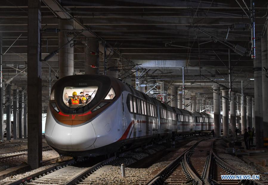 A train of the Guangzhou Metro Line 18 is under hot-running test in Guangzhou, south China's Guangdong Province, March 3, 2021. The electric train, with a maximum designed speed of 160 km per hour, carried out the first hot-running test in the small hours of Thursday morning, in order to conduct a comprehensive inspection of the subway power supply, signal, communication, line, and electromechanical system of the line. (Xinhua/Liu Dawei)