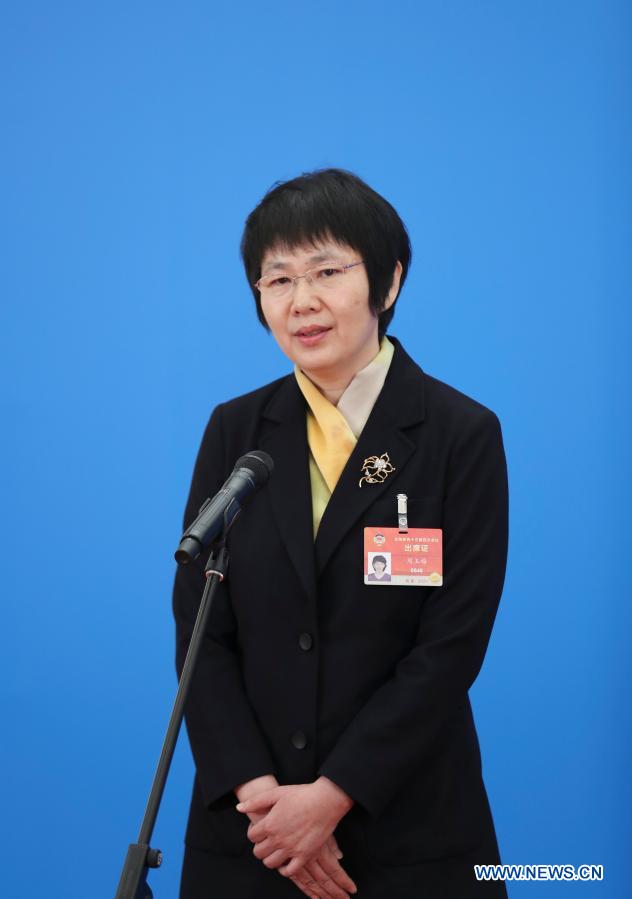 Zhou Yumei, a member of the 13th National Committee of the Chinese People's Political Consultative Conference (CPPCC), gives an interview via video link ahead of the second plenary meeting of the fourth session of the 13th CPPCC National Committee at the Great Hall of the People in Beijing, capital of China, March 7, 2021. (Xinhua/Li Muzi)