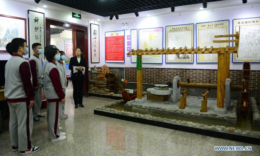 A teacher introduces an exhibit to the visiting students at the Zu Chongzhi Memorial Hall at the Zu Chongzhi High School in Laishui County, north China's Hebei Province, March 13, 2021. March 14 is celebrated around the world as Pi Day, since 3, 1, and 4 are the first three significant digits of the mathematical constant which denotes the ratio of a circle's circumference to its diameter. Zu Chongzhi, a Chinese mathematician and astronomer from the 5th century, had made a remarkable achievement by determining the Pi value with an accuracy of seven decimal places, between 3.1415926 and 3.1415927. His calculation remained the world's most accurate for nearly 1,000 years until the 14th century. (Xinhua/Jin Haoyuan)