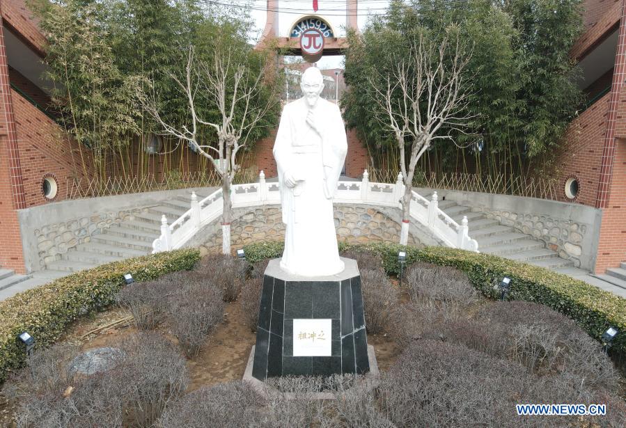 A statue of Zu Chongzhi is pictured at the Zu Chongzhi High School in Laishui County, north China's Hebei Province, March 13, 2021. March 14 is celebrated around the world as Pi Day, since 3, 1, and 4 are the first three significant digits of the mathematical constant which denotes the ratio of a circle's circumference to its diameter. Zu Chongzhi, a Chinese mathematician and astronomer from the 5th century, had made a remarkable achievement by determining the Pi value with an accuracy of seven decimal places, between 3.1415926 and 3.1415927. His calculation remained the world's most accurate for nearly 1,000 years until the 14th century. (Xinhua/Jin Haoyuan)