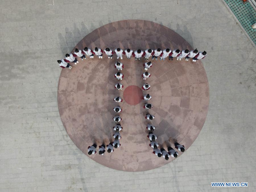 Aerial photo taken on March 13, 2021 shows students of the Zu Chongzhi High School standing in a formation of the Greek letter 