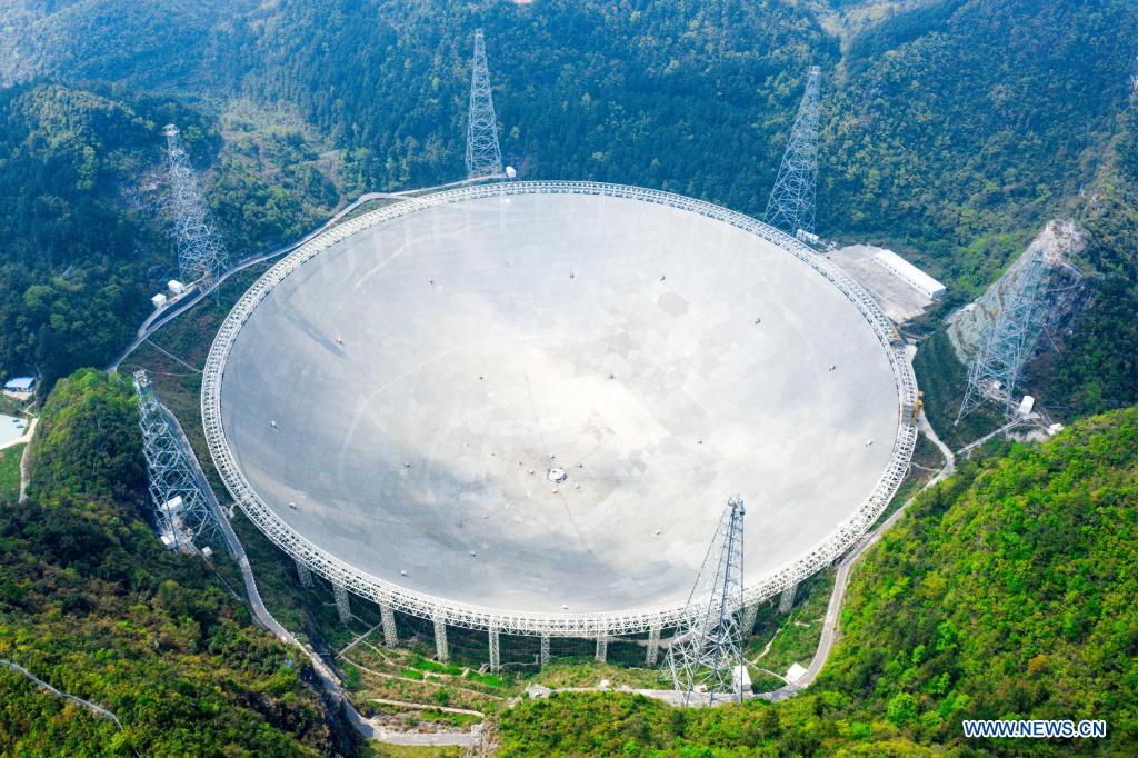 Aerial photo taken on March 28, 2021 shows China's Five-hundred-meter Aperture Spherical Radio Telescope (FAST) under maintenance in southwest China's Guizhou Province. China's FAST officially opened to the world starting Wednesday. (Xinhua/Ou Dongqu)