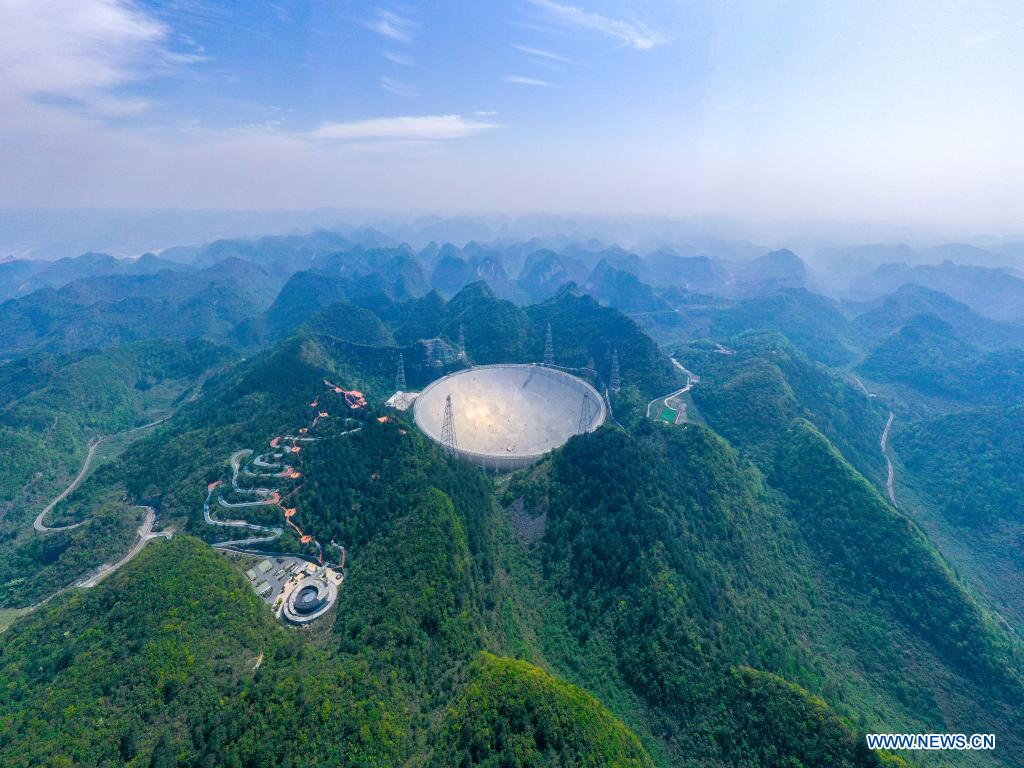 Aerial photo taken on March 29, 2021 shows China's Five-hundred-meter Aperture Spherical Radio Telescope (FAST) under maintenance in southwest China's Guizhou Province. China's FAST officially opened to the world starting Wednesday. (Xinhua/Ou Dongqu)