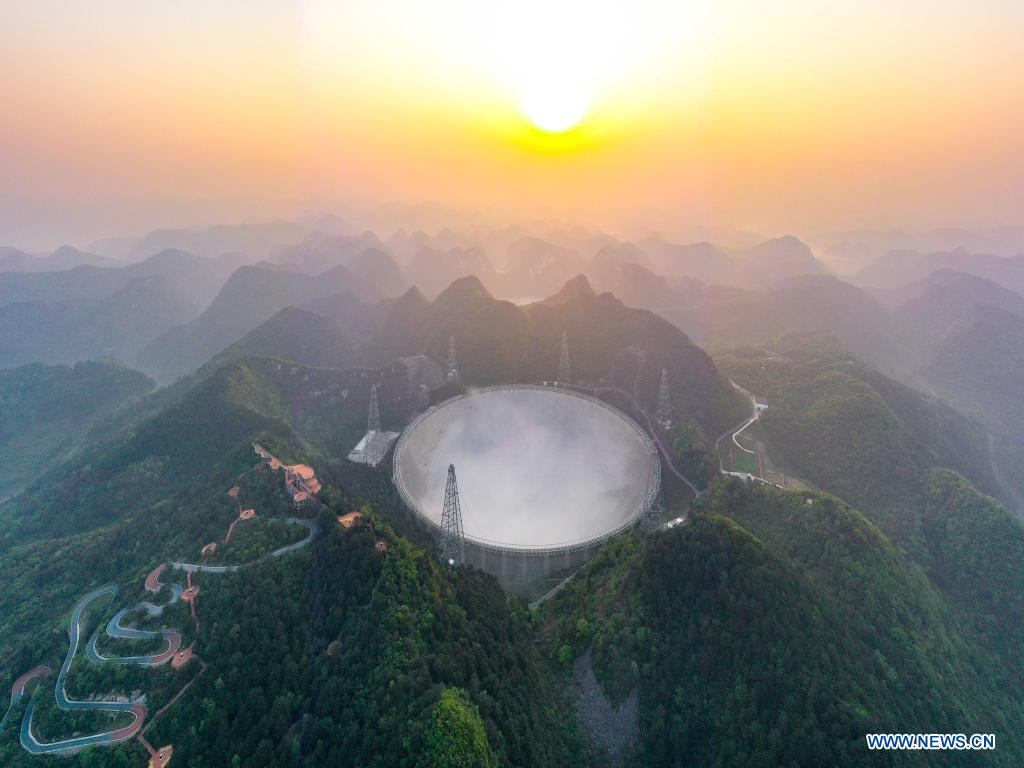 Aerial photo taken on March 31, 2021 shows China's Five-hundred-meter Aperture Spherical Radio Telescope (FAST) under maintenance in southwest China's Guizhou Province. China's FAST officially opened to the world starting Wednesday. (Xinhua/Ou Dongqu)