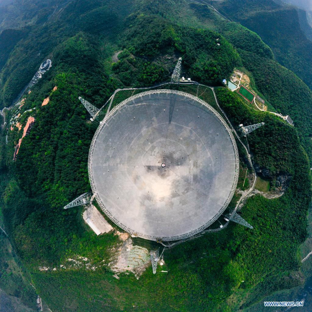 Aerial photo taken on March 28, 2021 shows China's Five-hundred-meter Aperture Spherical Radio Telescope (FAST) under maintenance in southwest China's Guizhou Province. China's FAST officially opened to the world starting Wednesday. (Xinhua/Ou Dongqu)