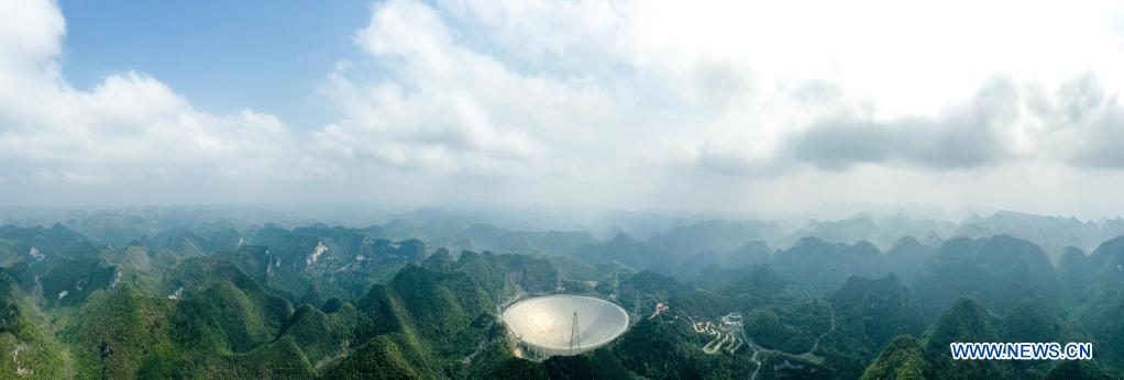 Aerial photo taken on March 28, 2021 shows China's Five-hundred-meter Aperture Spherical Radio Telescope (FAST) under maintenance in southwest China's Guizhou Province. China's FAST officially opened to the world starting Wednesday. (Xinhua/Ou Dongqu)