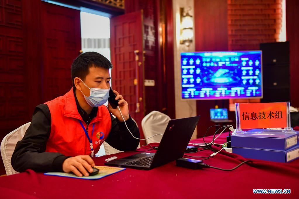 A technician works to support the prevention and control applet in Ruili City, southwest China's Yunnan Province, April 6, 2021. Frontline medical workers, epidemic prevention and control personnel, border patrol personnel and volunteers from all walks of life work hard to control the spread of the novel coronavirus after new cluster infections were reported late March. (Xinhua/Chen Xinbo)