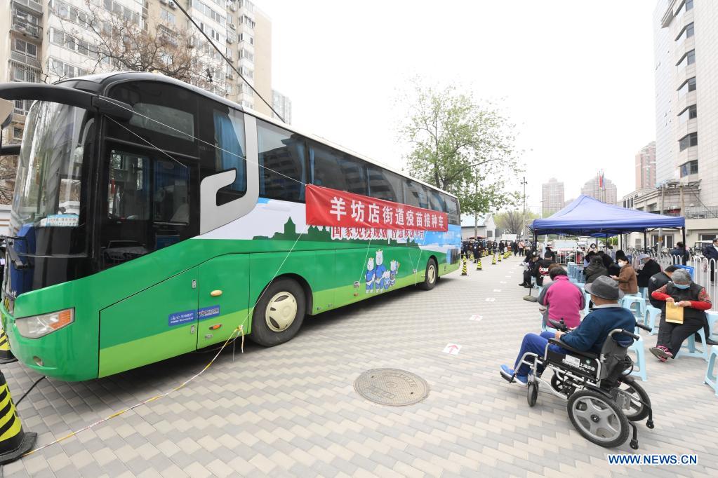 Photo taken on April 11, 2021 shows a mobile vaccination vehicle in Haidian District of Beijing, capital of China, April 11, 2021. Beijing and Shanghai have deployed mobile vaccination vehicles in downtown areas. The bus-like facilities, equipped with vaccination stations, medical refrigerators and first-aid equipment, have been rolled out to save time and improve inoculation efficiency. (Xinhua/Ren Chao)