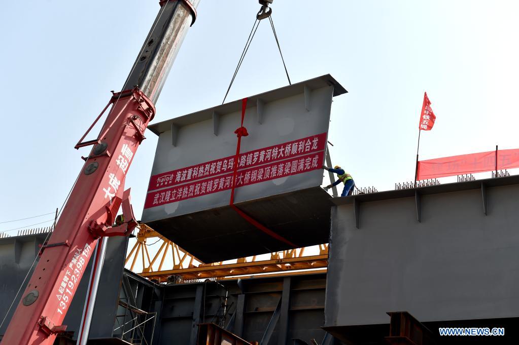 Photo taken on April 11, 2021 shows the construction site of Zhenluo Yellow River Bridge in Zhongwei City, northwest China's Ningxia Hui Autonomous Region. The 1,289-meter-long Zhenluo Yellow River Bridge in the Ningxia section of the Wuhai-Maqin expressway finished its final stage for closure Sunday. (Xinhua/Tang Rufeng)