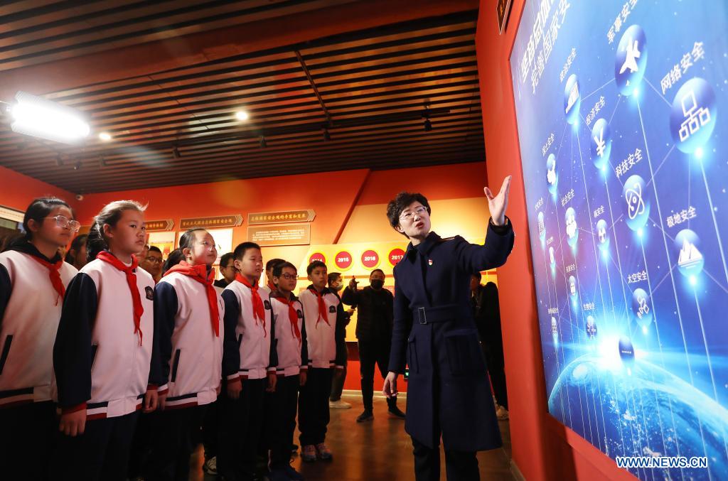 Students visit the exhibition hall in an education and training base on Liugong Island in the city of Weihai, east China's Shandong Province, April 13, 2021. Primary and secondary school students take part in educational activities ahead of the National Security Education Day that falls on April 15. (Xinhua/Zhu Zheng)