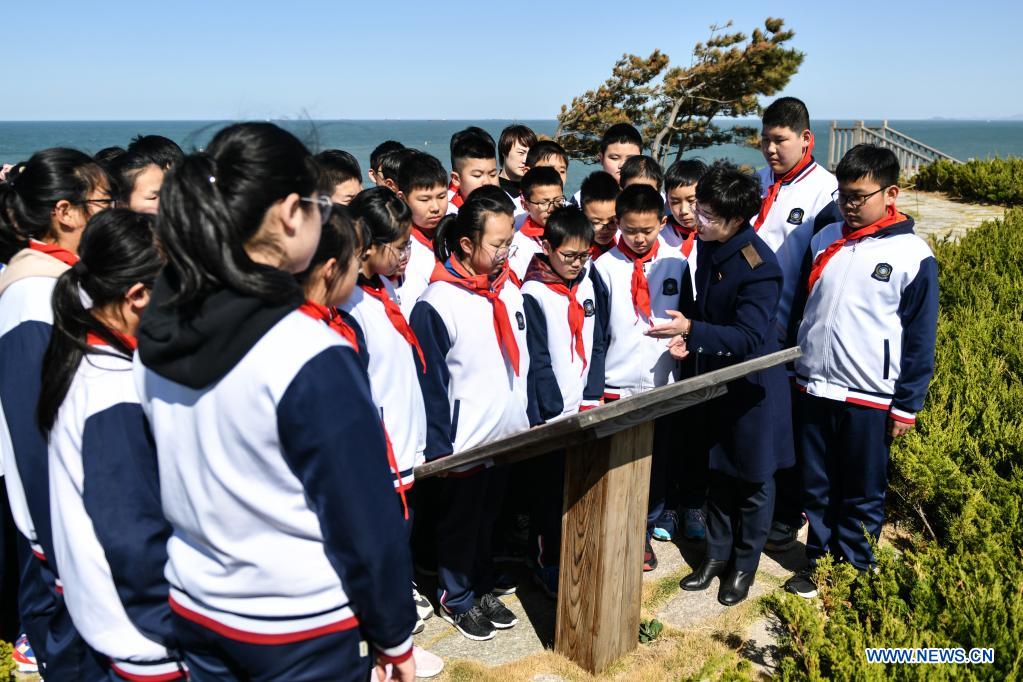 Students visit a fort relic site in an education and training base on Liugong Island in the city of Weihai, east China's Shandong Province, April 13, 2021. Primary and secondary school students take part in educational activities ahead of the National Security Education Day that falls on April 15. (Xinhua/Zhu Zheng)