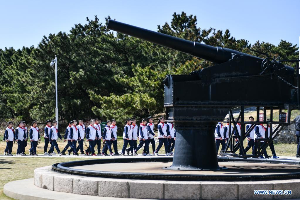 Students visit a fort relic site in an education and training base on Liugong Island in the city of Weihai, east China's Shandong Province, April 13, 2021. Primary and secondary school students take part in educational activities ahead of the National Security Education Day that falls on April 15. (Xinhua/Zhu Zheng)