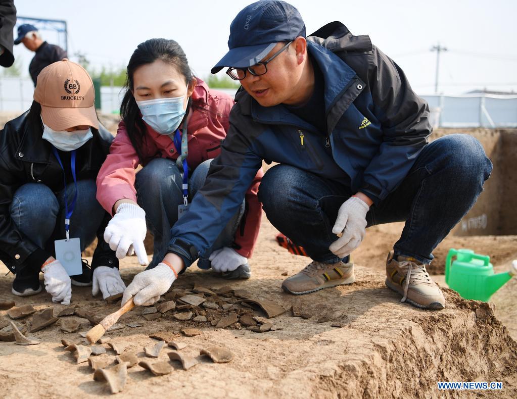 Shen Wenxi teaches archeological enthusiasts to identify types of pottery in Anyang, central China's Henan Province, April 8, 2021. Anyang is listed as one of the 