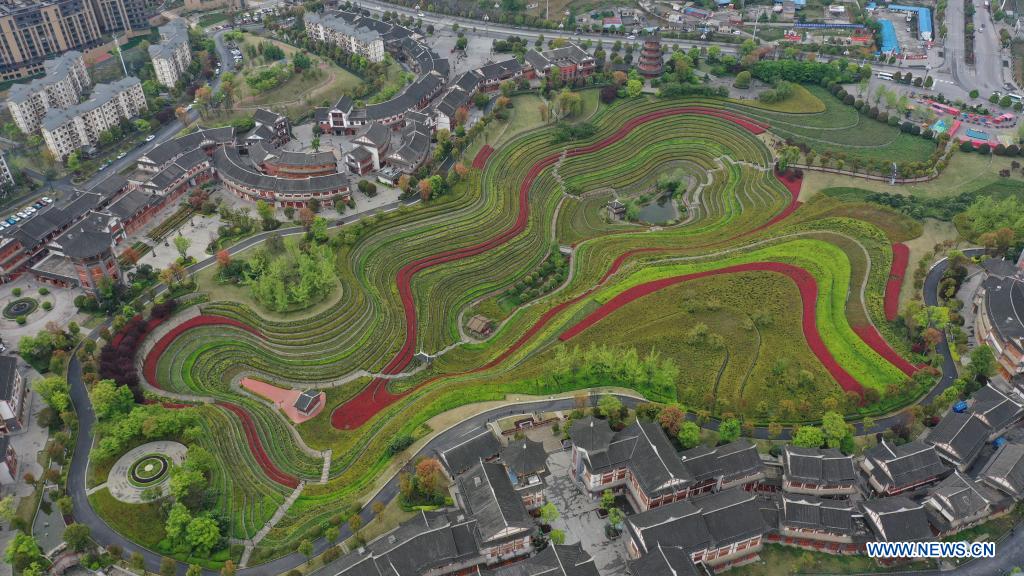 Aerial photo taken on April 14, 2021 shows the spring scenery of terraced fields in Shexiang ancient town in Dafang County of Bijie, southwest China's Guizhou Province. (Xinhua/Yang Ying)