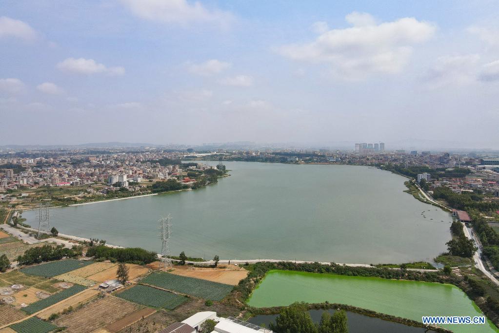 Aerial photo taken on April 13, 2021 shows Longhu Lake in Jinjiang City, the source of a water-diversion project connecting the Chinese mainland coastal province of Fujian to the island of Kinmen in Jinjiang, southeast China's Fujian Province. The water pipeline connecting Fujian to Kinmen went into operation in 2018, delivering water from Fujian's Jinjiang River to alleviate water shortages. (Photo by Lai Jincai/Xinhua)