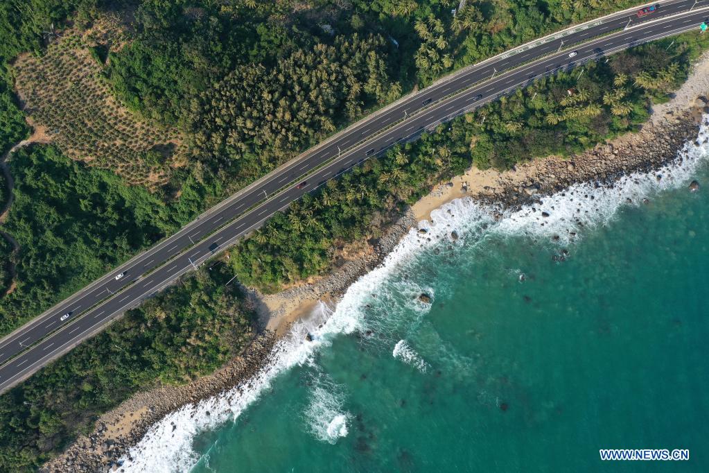 Aerial photo taken on Dec. 30, 2020 shows a view of a section of Hainan Ring Expressway in south China's Hainan Province. Hainan has made significant progress in the construction of expressway since the 13th Five-Year Plan, which started in 2016. By far, the total mileage of expressways in the province has reached 1,255 kilometers. The transport upgrade will help boost the building of Hainan into an international tourism and consumption center. (Xinhua/Guo Cheng)