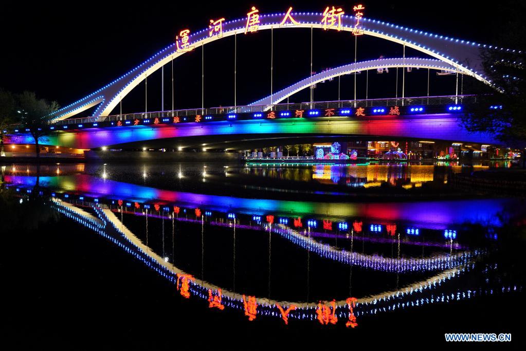 Photo taken on April 13, 2021 shows a view of the Tangjin canal at night in Fengnan District of Tangshan, north China's Hebei Province. Fengnan District authorities have taken steps to advance a holistic urban water management program in recent years. The program aims at shaping a sound environment for life improvement, industrial development, and refinement of the urban landscape. (Xinhua/Mu Yu)