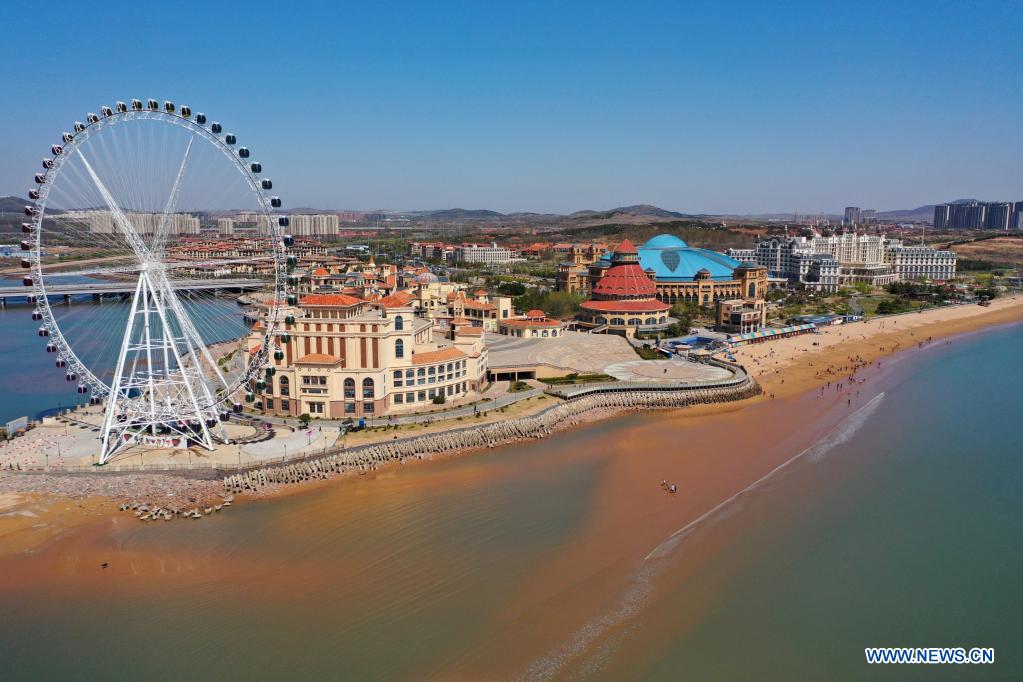 Aerial photo taken on April 18, 2021 shows a view of the coastline at Aoshan Bay in Qingdao, east China's Shandong Province. (Photo by Liang Xiaopeng/Xinhua)
