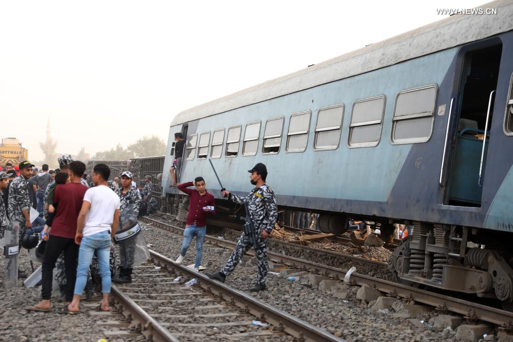 People gather at the site of a train derailment in the Delta city of Toukh, Egypt, on April 18, 2021. At least 97 people were wounded in a train derailment on Sunday in the Delta city of Toukh, north of the Egyptian capital Cairo, the Egyptian Health Ministry said. (Xinhua/Ahmed Gomaa)