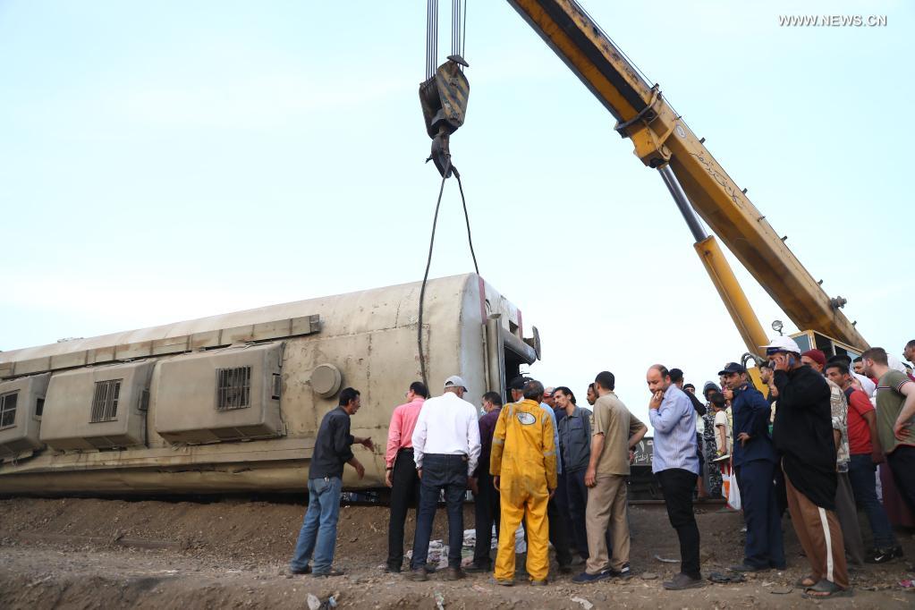 Rescuers work at the site of a train derailment in the Delta city of Toukh, Egypt, on April 18, 2021. At least 97 people were wounded in a train derailment on Sunday in the Delta city of Toukh, north of the Egyptian capital Cairo, the Egyptian Health Ministry said. (Xinhua/Ahmed Gomaa)