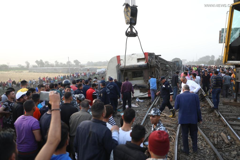 People gather at the site of a train derailment in the Delta city of Toukh, Egypt, on April 18, 2021. At least 97 people were wounded in a train derailment on Sunday in the Delta city of Toukh, north of the Egyptian capital Cairo, the Egyptian Health Ministry said. (Xinhua/Ahmed Gomaa)